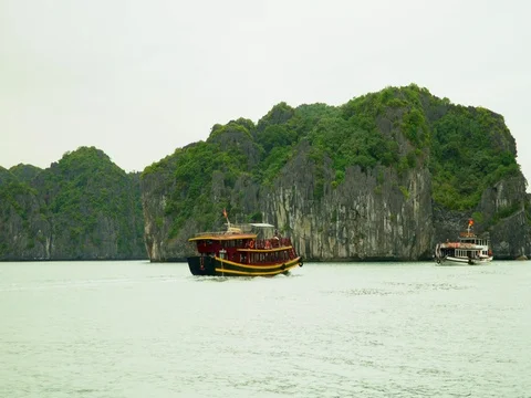 Two boats with tourists part in different directions. Stunning aerial shot in Stock Footage 84683821