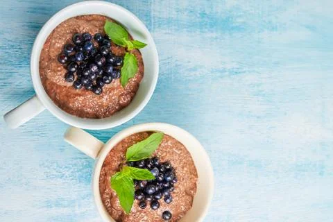Two boils with Chia seed pudding with berries and carob Stock Photos