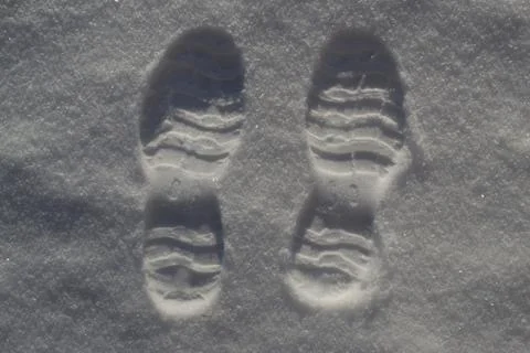 Two Bootpints in the Snow. Stock Photos