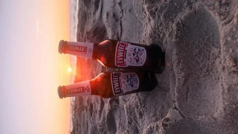 Two bottles of beer on the beach during sunset by the Baltic Sea Stock Photos