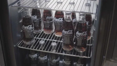 Two bottles of cola being taken out from refrigerator Stock Footage 159192820