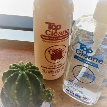 TWO BOTTLES: HAND SANITIZING GEL AND SOAP, WOODEN TABLE, OUTDOORS, HD Stock-Fotos