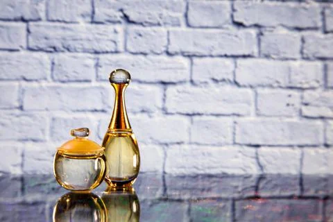 Two bottles of perfume on the table Stock Photos