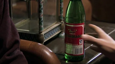 Two bottles of white wine are placed on the table Stock Footage 252482087