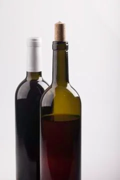 Two bottles of wine on white background closeup Stock Photos