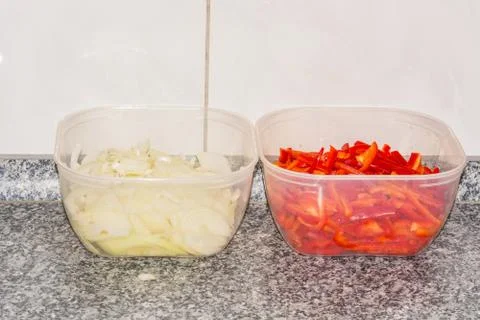 Two bowls with peppers and onions Stock Photos