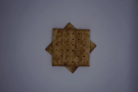 Two box biscuits arranged into a star on a gray background, Top view Stock Photos