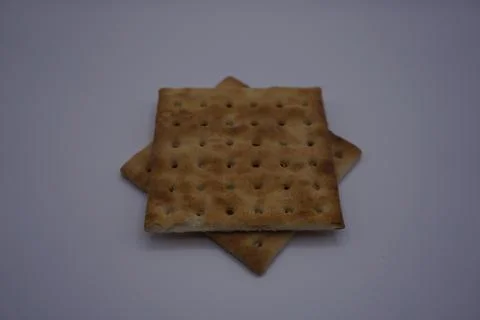 Two box biscuits arranged into a star on a gray background Stock Photos