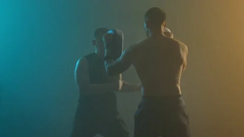 Two Boxers Are Training. One Man Punches And Kicks Another. Vídeos de archivo 160764218