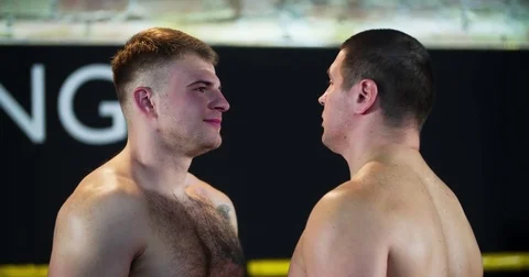 Two boxers face-off looks each other before fight 4k video boxing ring close-up Stock Footage 70391043