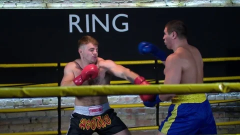 Two boxers fight boxing ring HD slow motion video. Fighter punched in head faces Stock Footage 70386034
