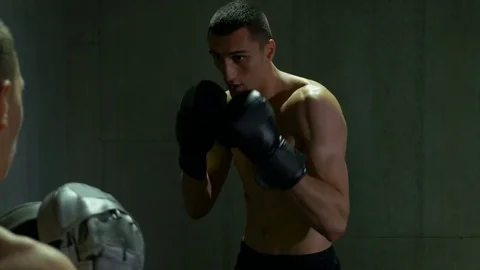 Two boxers sparring and fighting at the gym Stock Footage 77795351