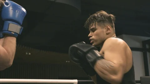 Two boxers training punches and defense Stock Footage 89841803