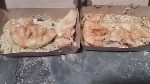 Two boxes of delicious noodles, spicy and not spicy Stock Footage 295014366