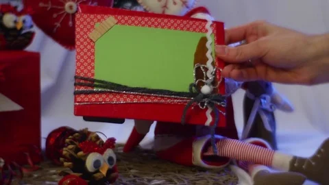 Two Boxes With Photo Frames Are Put Under a Christmas Fir Tree Among Other Stock Footage 72884017