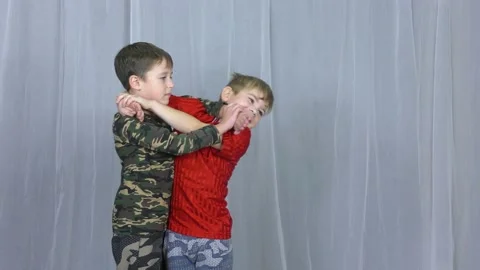 Two boy athlete perform the technique of release from the grip by the head Stock Footage 141545471