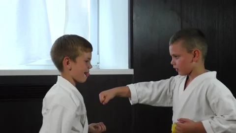 Two boy athletes perform active paired exercises Stock Footage 232615912