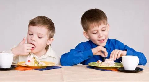 Two boy with cake Stock Photos