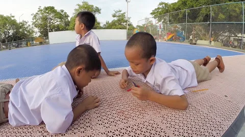Two boy student have fun to play game of blowing wood 스톡 동영상 44920504