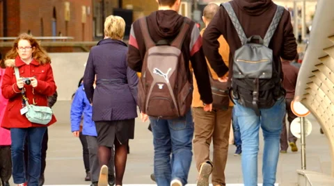 Two Boys with backpack walking through a crowd Video stock 36567555