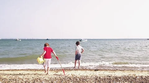 Two boys on the beach Stock Footage 72657689
