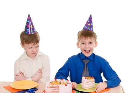 Two boys with cake Stock Photos