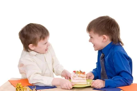 Two boys with cake Stock Photos