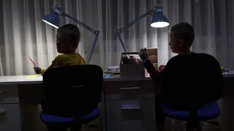 Two boys at the desk and working on drawings. Stock Footage 300503195
