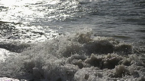 Two boys dive into a foaming wave. Live a healthy life. Be H3althy 動画素材 332368568