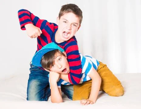 Two boys fighting Stock Photos