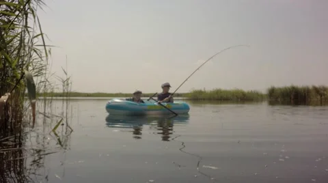 Two boys float on an inflatable boat. Video stock 66029983