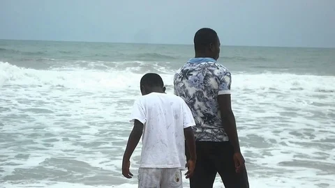 Two boys in front of the ocean Stock Footage 81225233