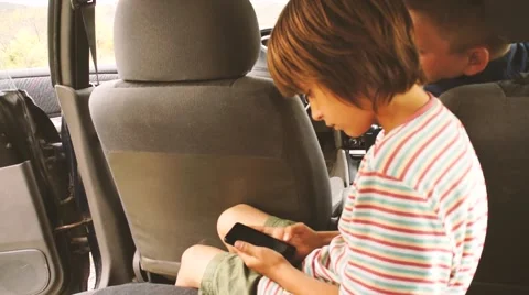 Two boys gaming on smartphone Stock Footage 61968271