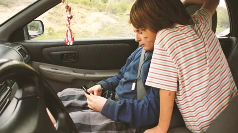 Two boys gaming on smartphone Stock Footage 61968283
