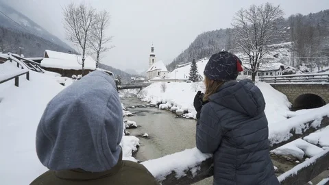 Two boys look out over creek at Church in German valley Stock Footage 120978526
