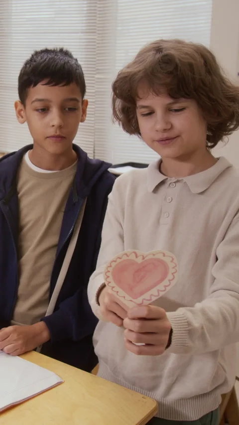 Two Boys Making Valentine Cards in School Vertical Stock Footage 328326995