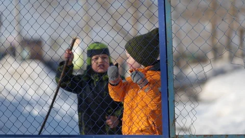 Two boys playing early spring, laughing at the camera, happy Video stock 105188313