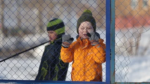 Two boys playing early spring, laughing at the camera, happy Video stock 105188316