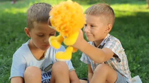 Two boys playing in the park Stock Footage 26180864
