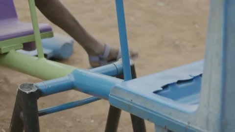 Two Boys Playing on a Seesaw Close Up Shot Stock Footage 243684309