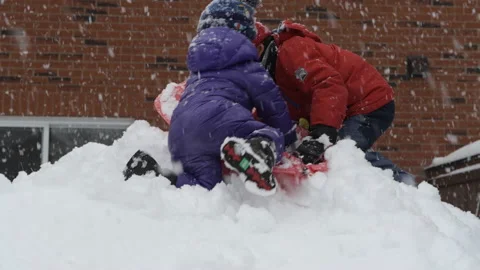 Two boys playing with a snow Video stock 149458631