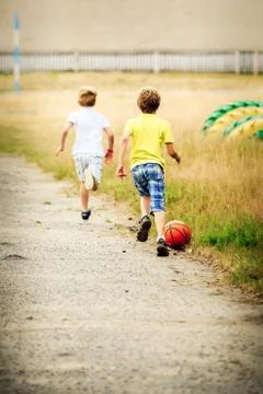 Two boys playing soccer Stock Photos