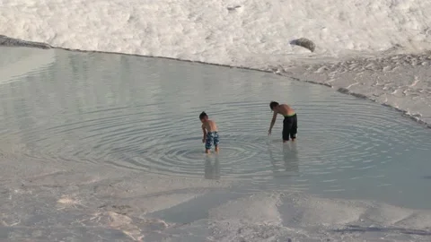 Two boys playing on travertines. Stock Footage 166019137