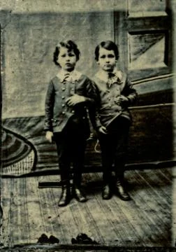 Two Boys posing with thumbs in jackets, tintype photo circa 1870 Foto stock
