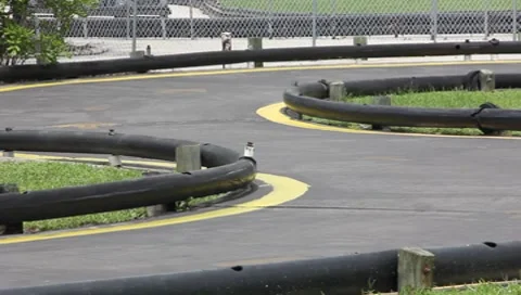 Two Boys Riding Go-Carts #1 Stock Footage 7733642