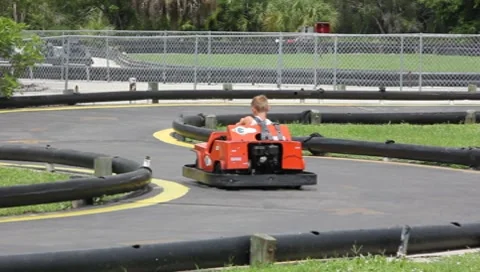 Two Boys Riding Go-Carts #2 Stock Footage 7733673