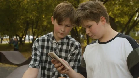 Two boys with smartphone Stock Footage 143791378