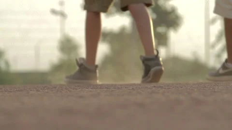Two Boys Walk on Baseball Field Gravel Stock Footage 41669849
