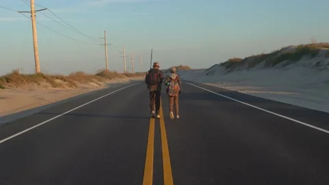 Two Boys Walking Down Lone Road Stock Footage 166716442