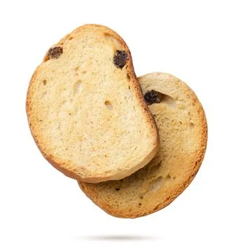 Two bread crumbs flying on a white background. Isolated Stock Photos